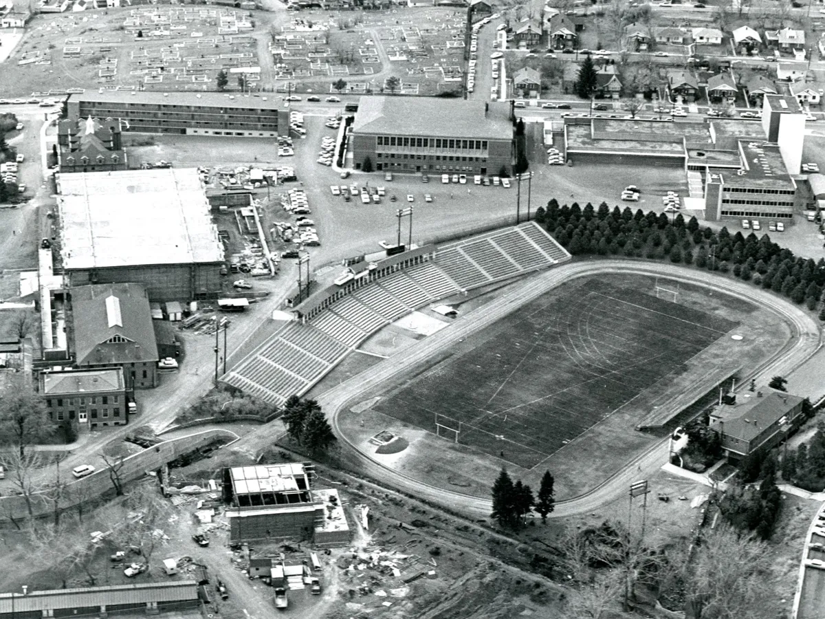 This black and white aerial photograph from 1960 shows the historic Mackay Stadium, Lincoln Hall, the Virginia Street Gymnasium, and the construction of Getchell Library.