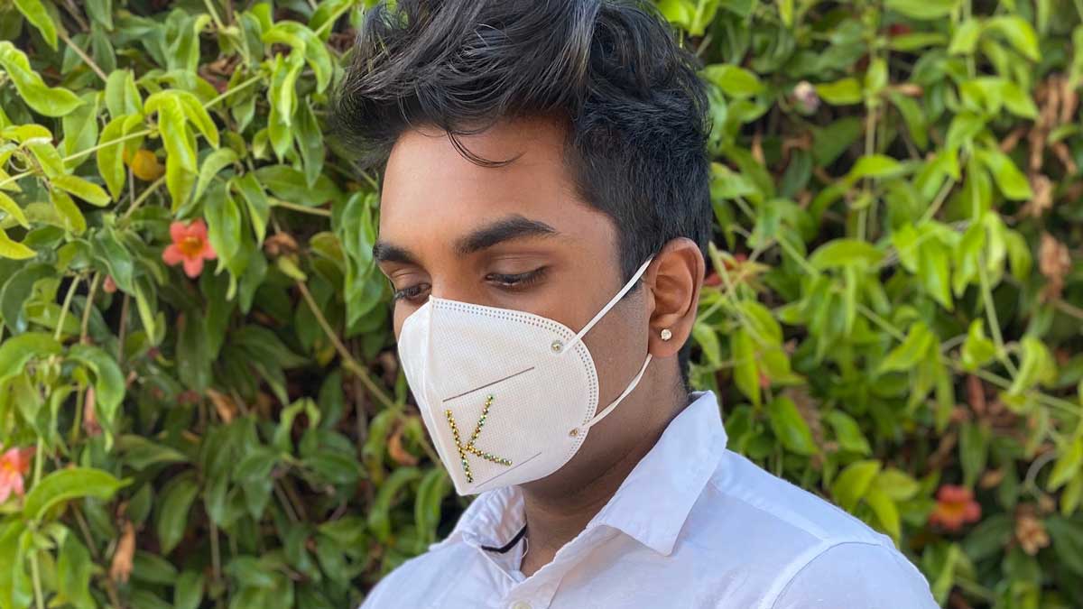 Kevin Sivakumar wearing a mask with a monogram K