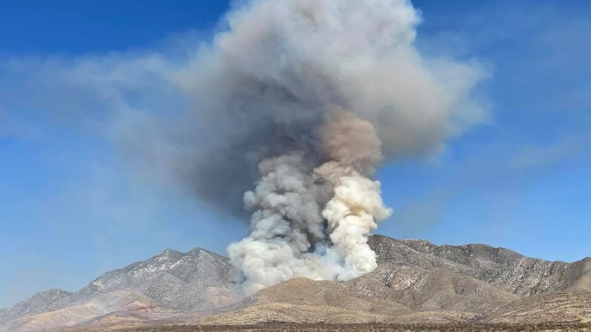The Sandy Valley Fire burns a mountainside in Southern Nevada.