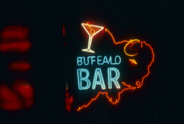 Neon on sign of the a buffalo that reads "Buffalo Bar"