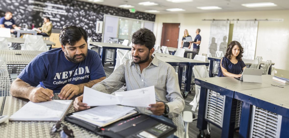 Students working on a project a table in the University's Innevation Center.