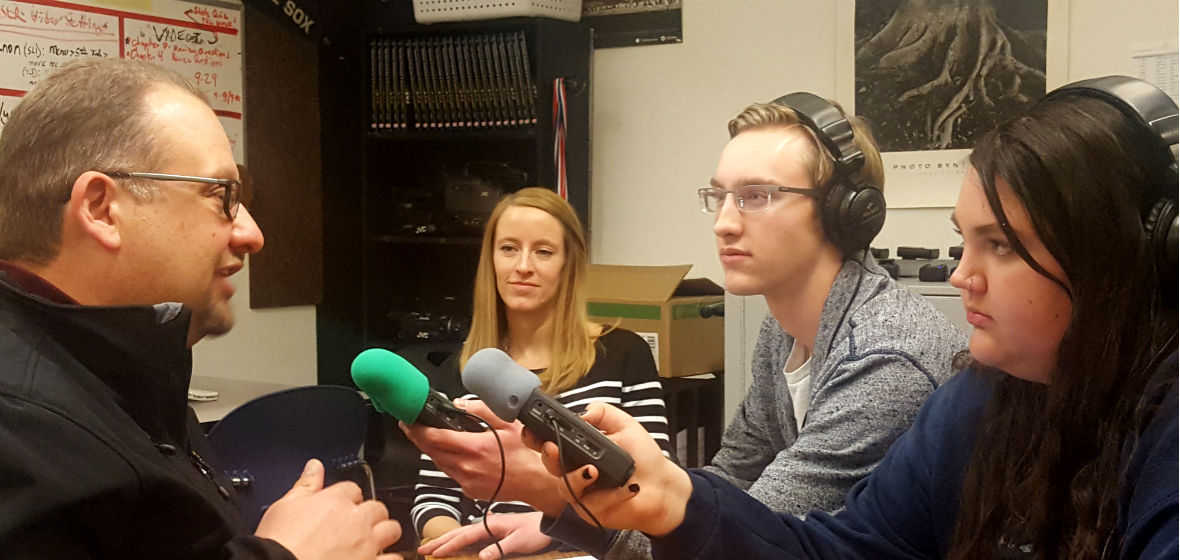 Two student reporters and two City of Reno officials