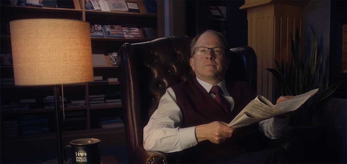 A man sits in an armchair.