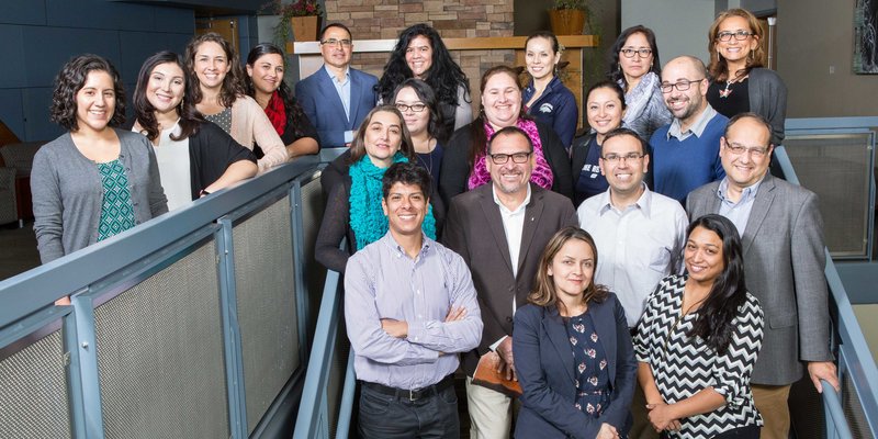 Members of Alianza posing on a stairway