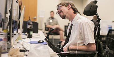 Student in wheelchair working at a computer
