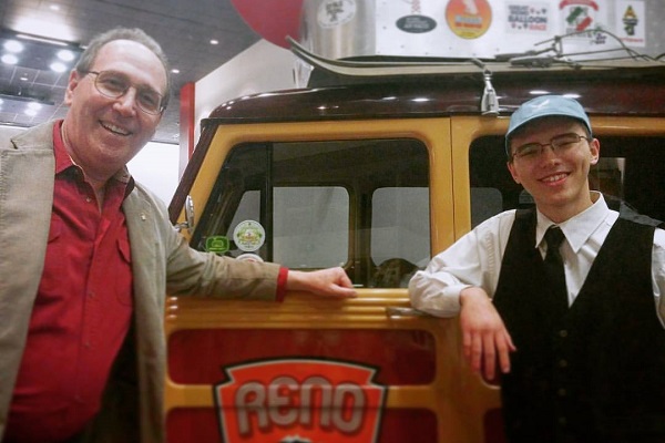 Michael Eardley and Daniel Lang pose with a classic automobile