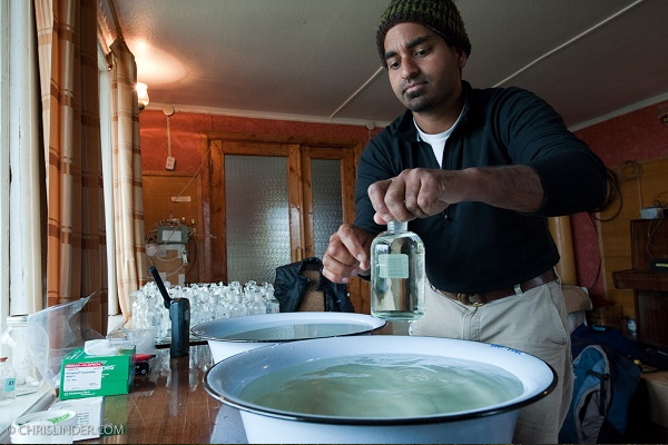 Sudeep Chandra, limnologist and lead scientist of the University of Nevada, Reno science team in Siberia, processes water samples in the lab on the barge.