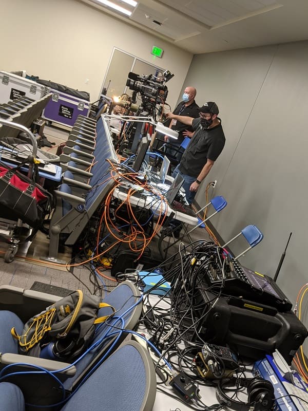 The mobile broadcast studio set-up in the back of William N. Pennington Engineering Building Room 130. Shawn Sariti (back) operating the camera and Kyle Weerheim (front) monitoring the equipment.