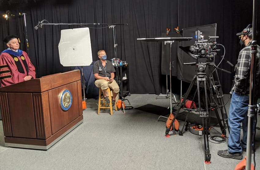 Provost Kevin Carman (left) recording his portion for the 2020 Virtual Commencement Ceremonies, while Maryan Tooker (middle) controls the teleprompter and Kyle Weerheim (right) operates the camera.