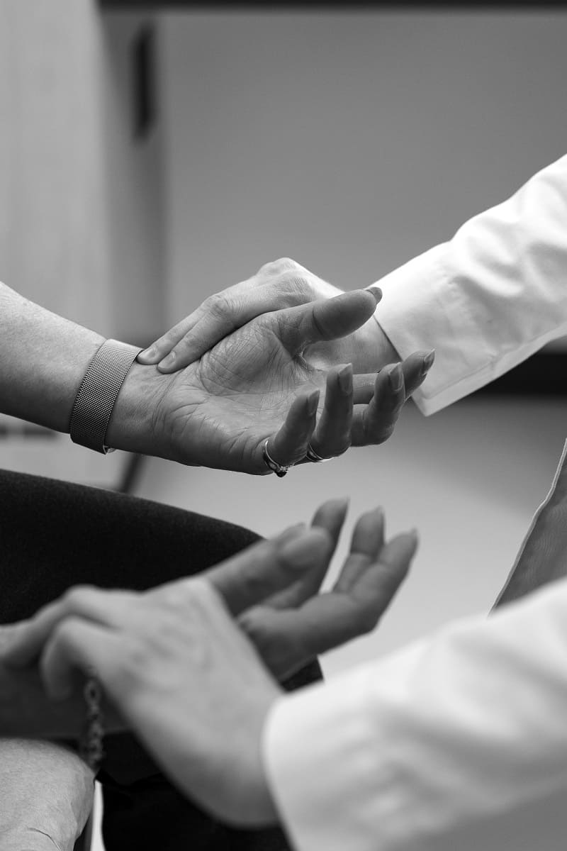  Sherrie Scaffidi at the clinic helping train medical students, her hands are in a doctor's