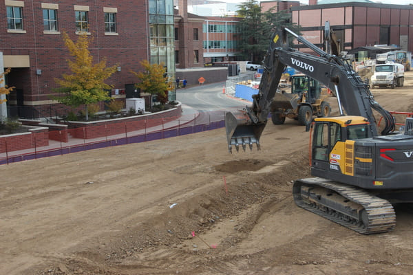 Heavy equipment working on dirt foundation
