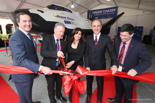 SNC's Dream Chaser spacecraft being unveiled with a ribbon cutting ceremony