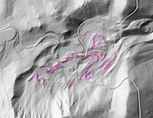 A black and white representation of the LIDAR scan of Mount Rose with pink links snaking along the sides of the mountain indicating glacial moraines