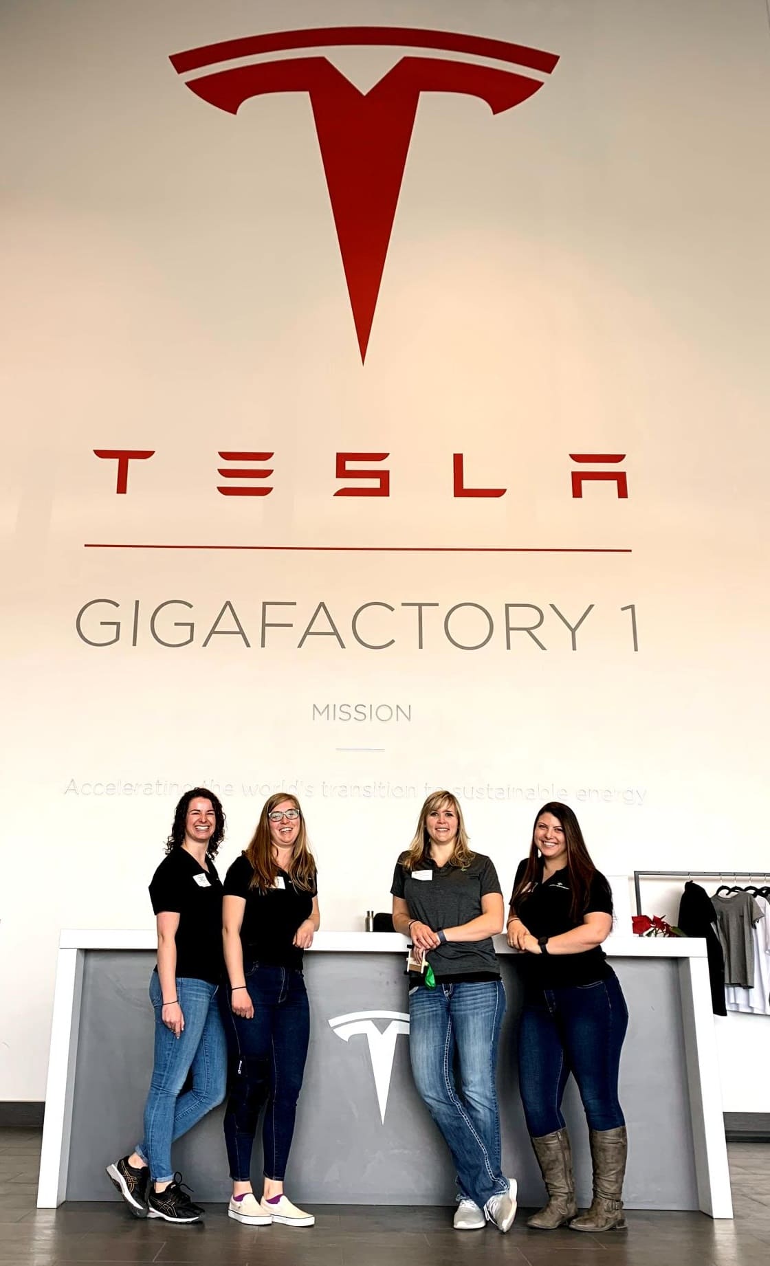 Lexi Robertson (left) with 3 cowokers from Wood Rogers volunteering at Tesla's "Introduce a Girl to Engineering Day" Feb. 2019.