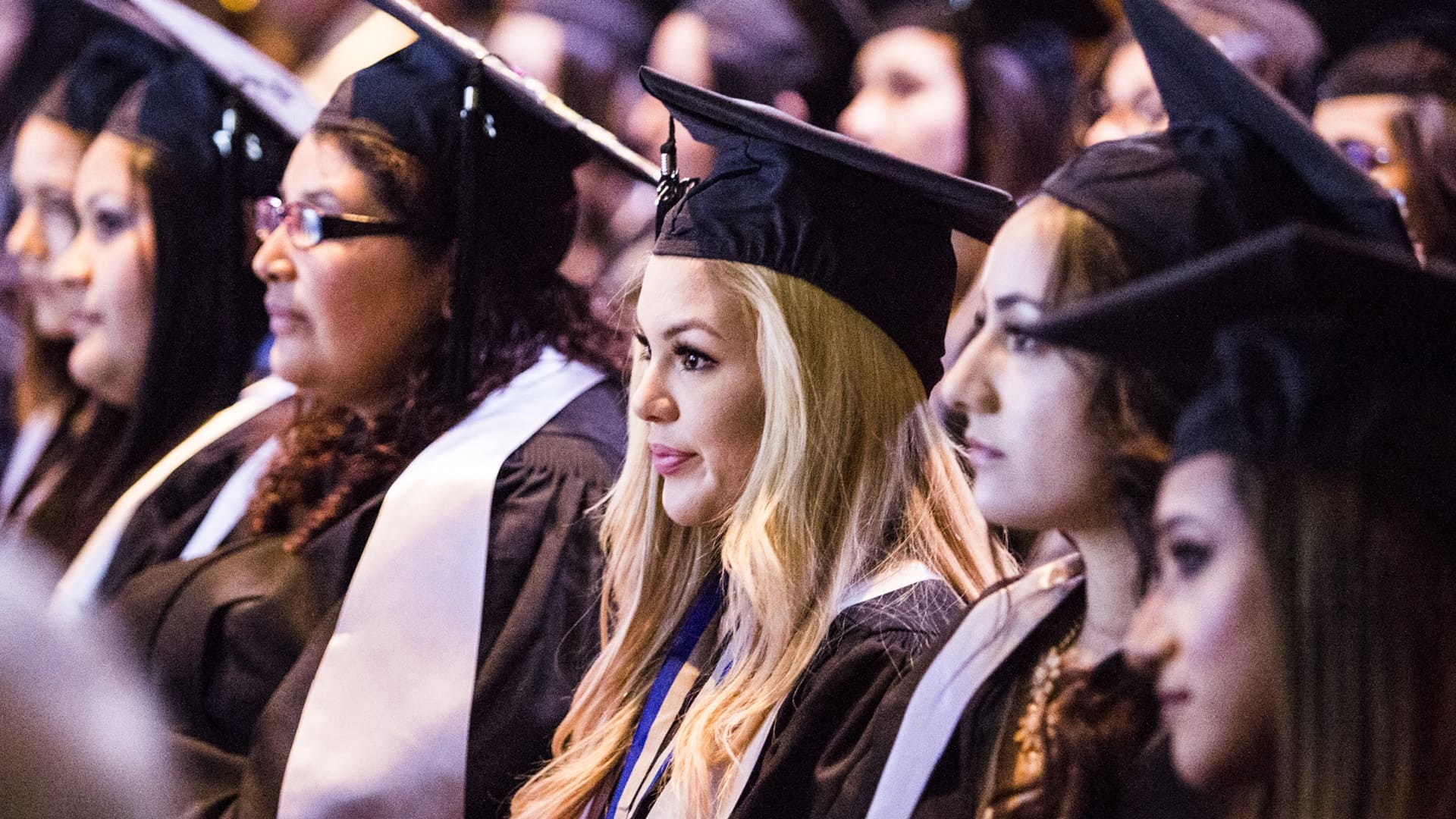 Women graduates at commencement in full regalia