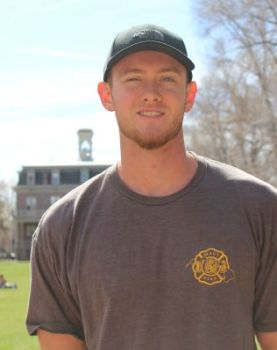 Student Andrew Sheets standing outside on the Quad