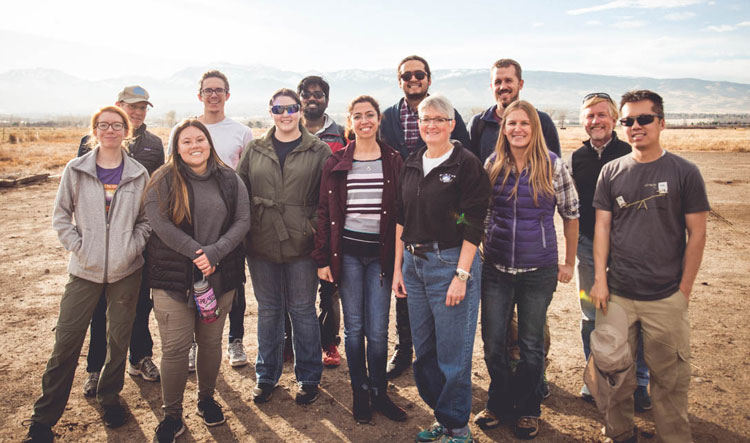 A group of students stand together for a photo