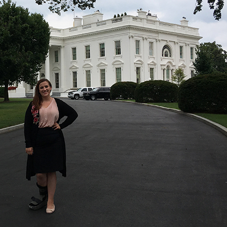 Katie Lou Hickman posing in front of the White House.