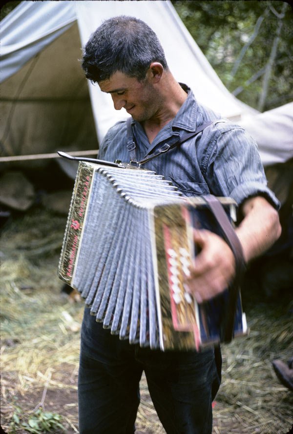 A Basque sheepherder plays the Trikitixa – a Basque accordion – to entertain himself at camp A Basque sheepherder plays the Trikitixa – a Basque accordion – to entertain himself at camp