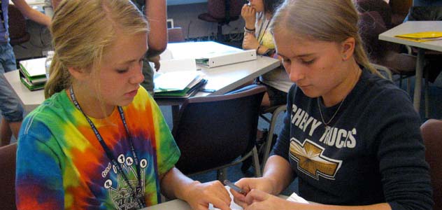 Two girls work together at an engineering camp