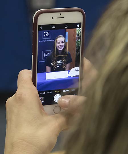 A cell phone photo being taken during a Nevada Scholars Signing Day ceremony