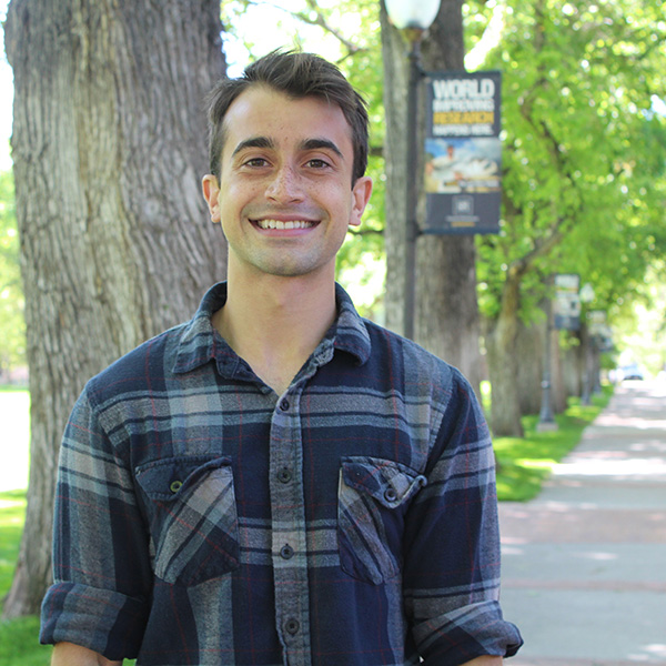 Adam Kirosingh stands in the Quad