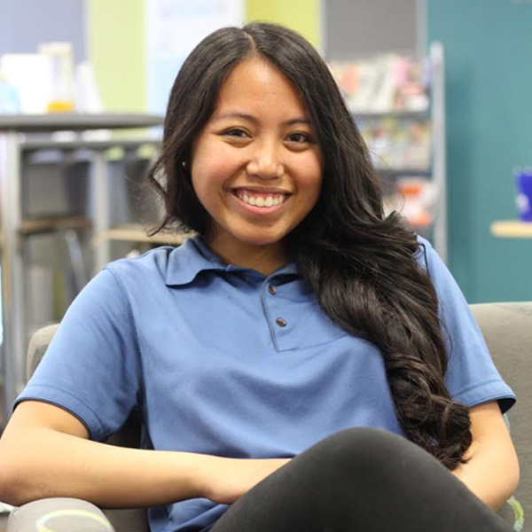 Gemma Beltran sits in a classroom