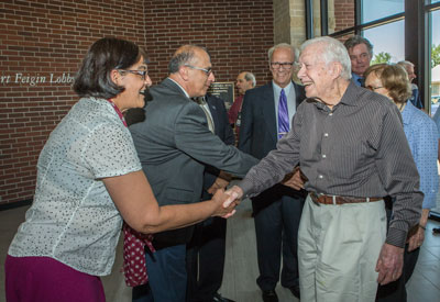 Associate Dean Indira Chatterjee greets Jimmy Carter and Department Chair Ahmad Itani greets Rosalynn Carter