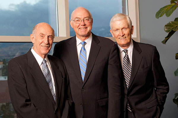 University presidents Joe Crowley, Marc Johnson, and John Lilley pose together