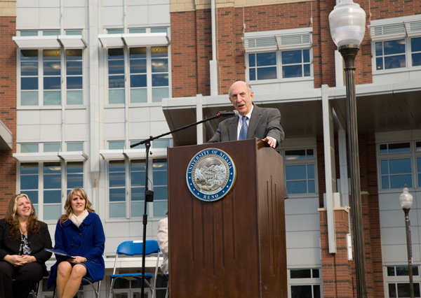 Joe Crowley speaking in front of the Joe Crowley Student Union at the dedication ceremony