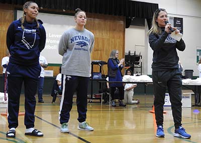 Women's Basketball Players and Coach Amanda Levens