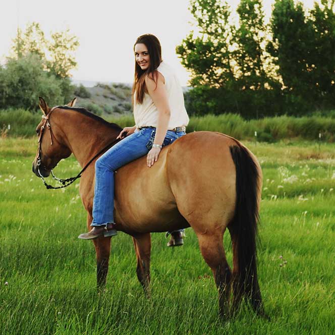 Jenna Damonte sitting on a horse