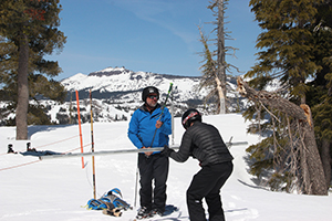 Geography professor Doug Boyle with grad student Paul Fremeau measure water content in the snow the old-fashioned way on Donner Summit