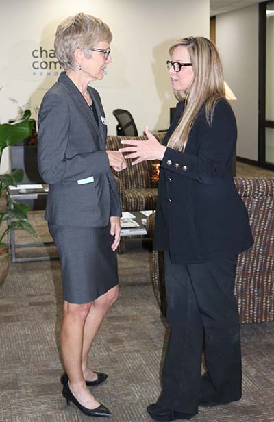 College of Liberal Arts Dean Debra Moddelmog and Reno Mayor Hillary Schieve stand and talk to each other