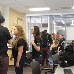 Volunteers and readers talk in the Writing Center.