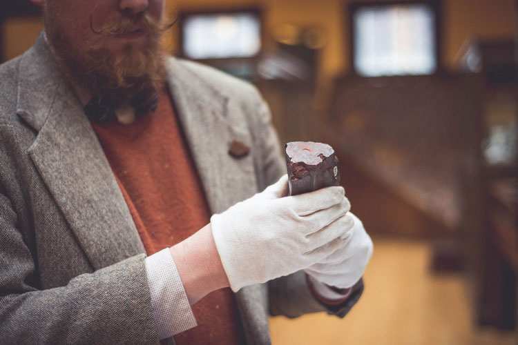 Garrett holds a hematite specimen