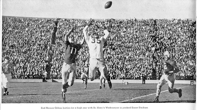 End Horace Gillom battles for a high one with St. Mary's Wedemeyer in packed Kezar Stadium