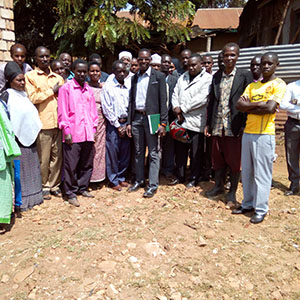 Liberatus in Nyakashenye with other village leaders in a meeting