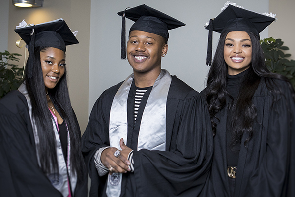 Smiling graduates at the African Diaspora Graduate Celebration