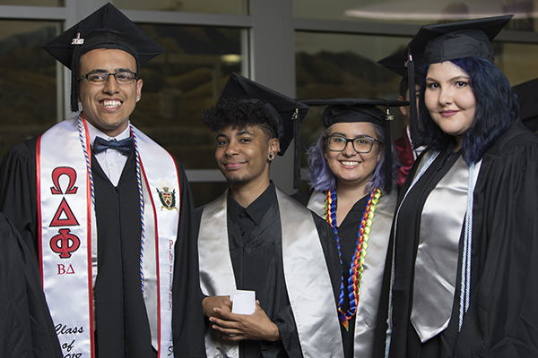 Graduates posing at the Lavender Graduate Celebration