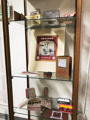 Bruce Licher works in a display case