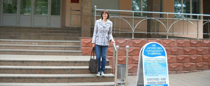 Evans stands outfront a library in one of the industrial cities she researched.