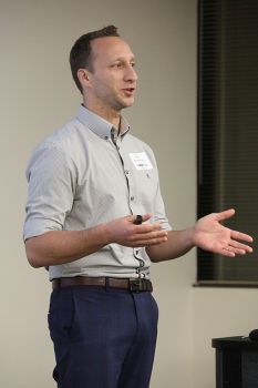 Man shown speaking, standing