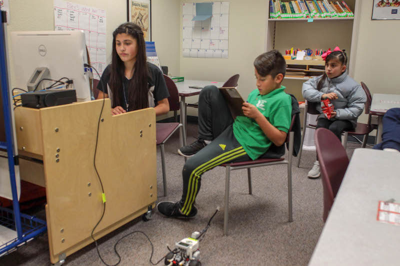 Students programming their Lego Mindstorm robots.