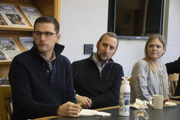 Faculty members listen in the Linn Reading Room.