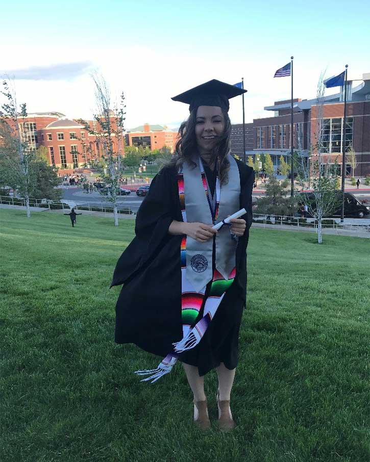 Ana in her cap and gown at the University