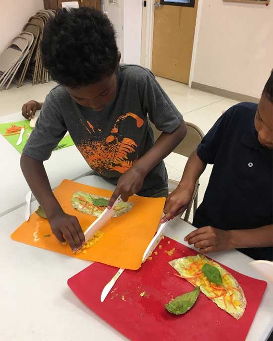 children making veggie wraps