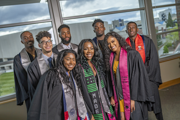 Smiling graduates at the African Diaspora Graduate Celebration