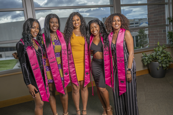 Smiling graduates at the African Diaspora Graduate Celebration