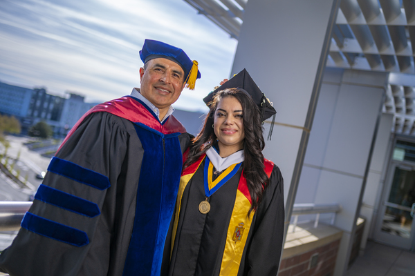 Graduates with a variety of honors around their necks outside the Latinx Graduate Celebration